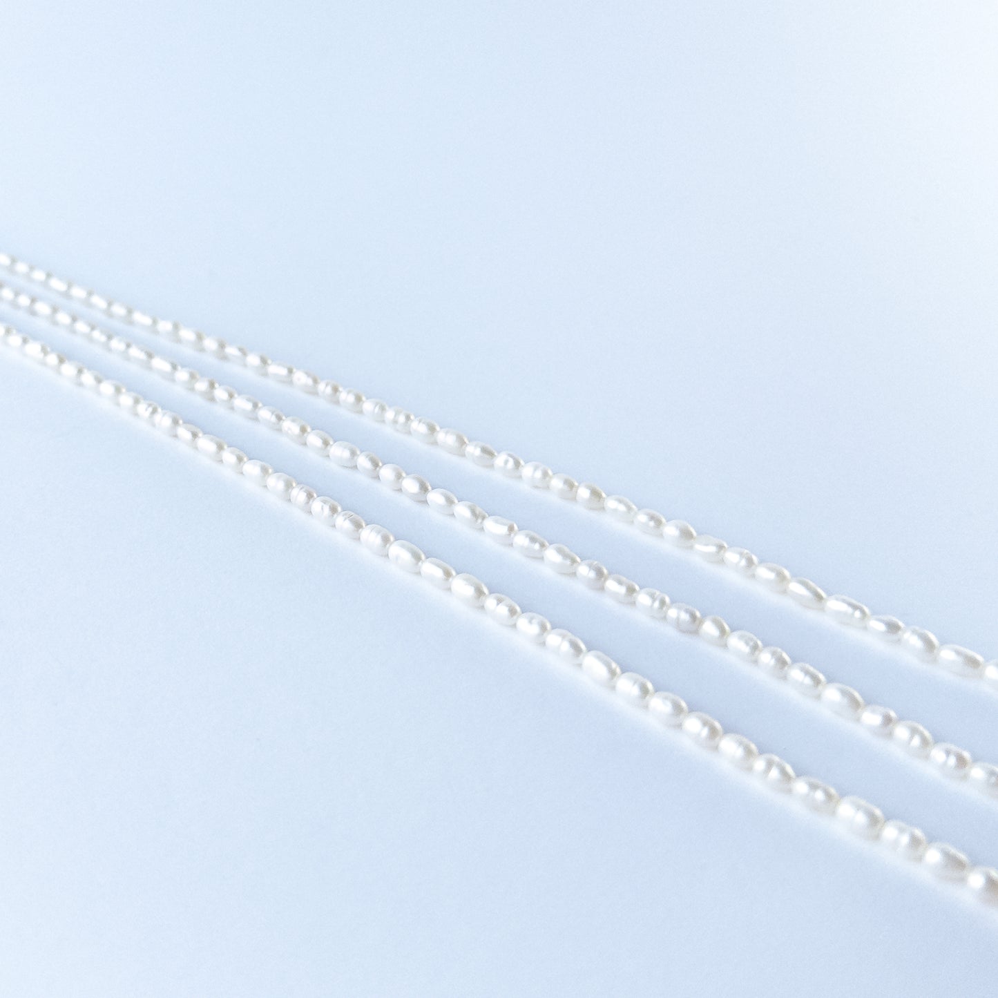 Close‑up of Freshwater Pearl fancy oval beads showing natural lustre, smooth shaping and high‑quality craftsmanship.