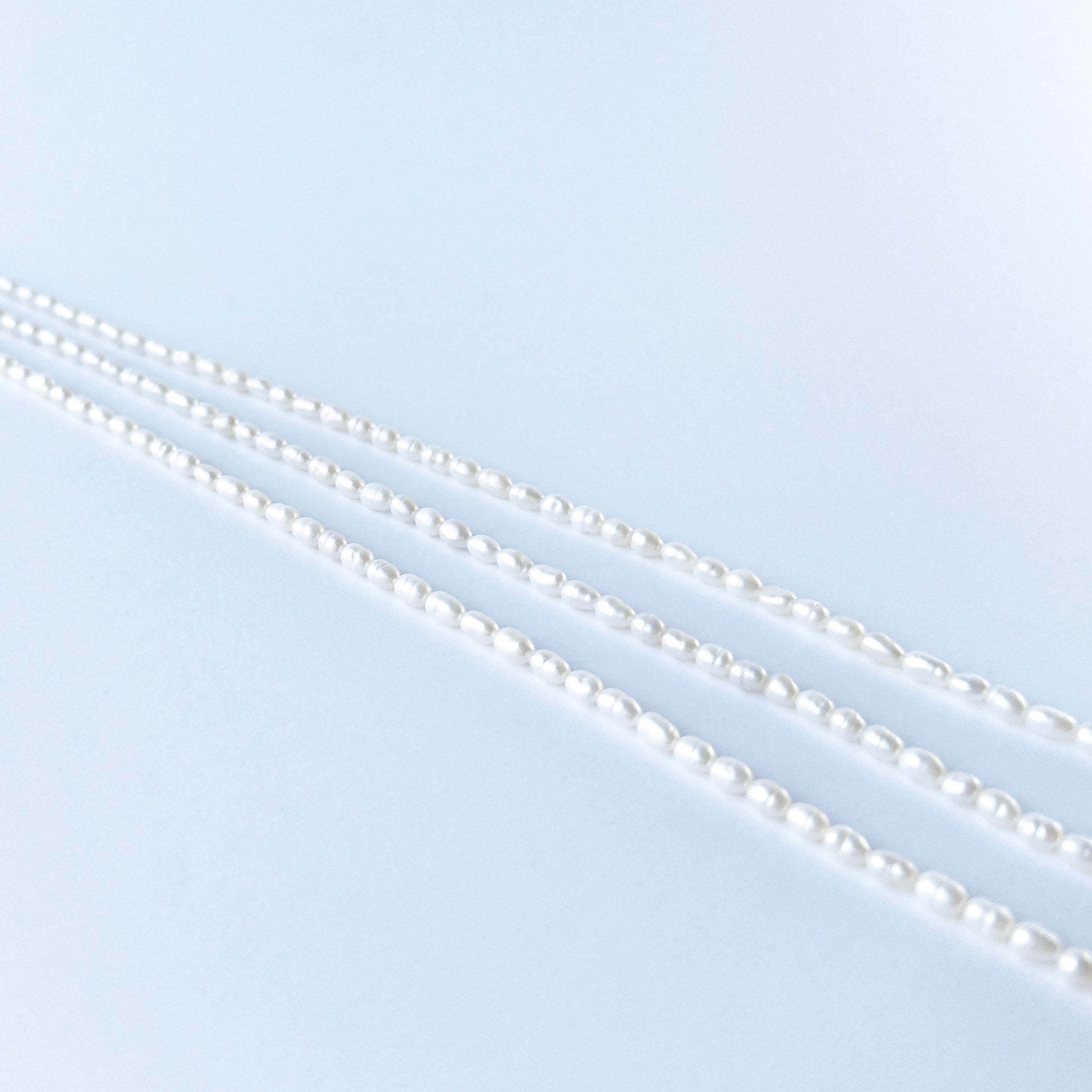 Close‑up of Freshwater Pearl fancy oval beads showing natural lustre, smooth shaping and high‑quality craftsmanship.