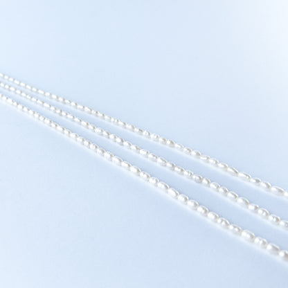 Close‑up of Freshwater Pearl fancy oval beads showing natural lustre, smooth shaping and high‑quality craftsmanship.