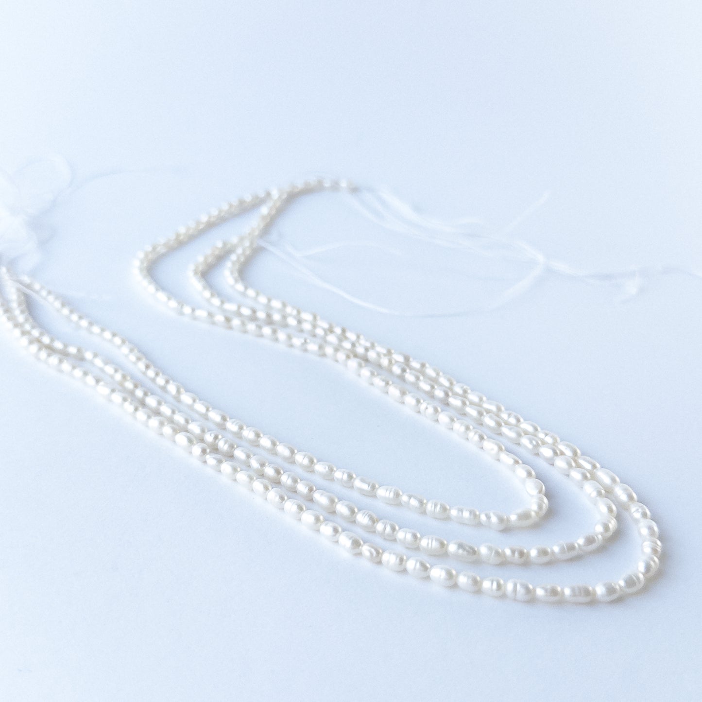 Genuine Freshwater Pearl stone beads showcasing natural lustre, refined shaping and handmade jewellery quality.
