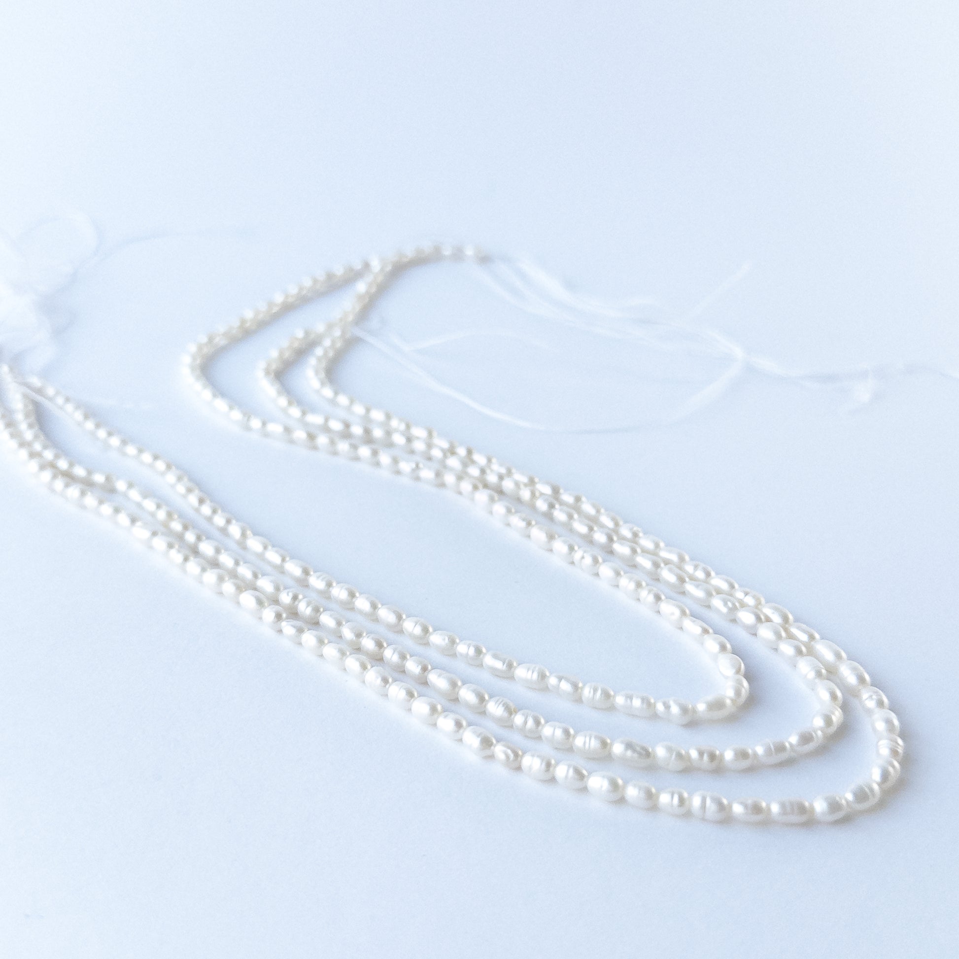 Genuine Freshwater Pearl stone beads showcasing natural lustre, refined shaping and handmade jewellery quality.