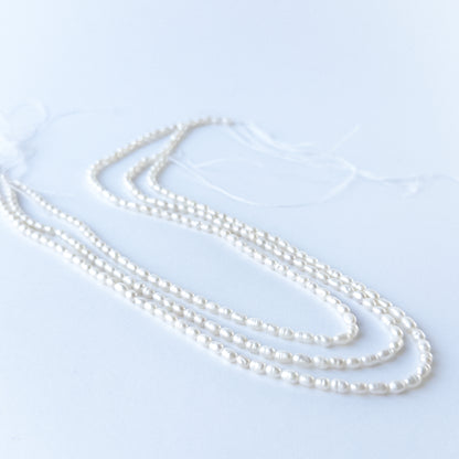 Genuine Freshwater Pearl stone beads showcasing natural lustre, refined shaping and handmade jewellery quality.