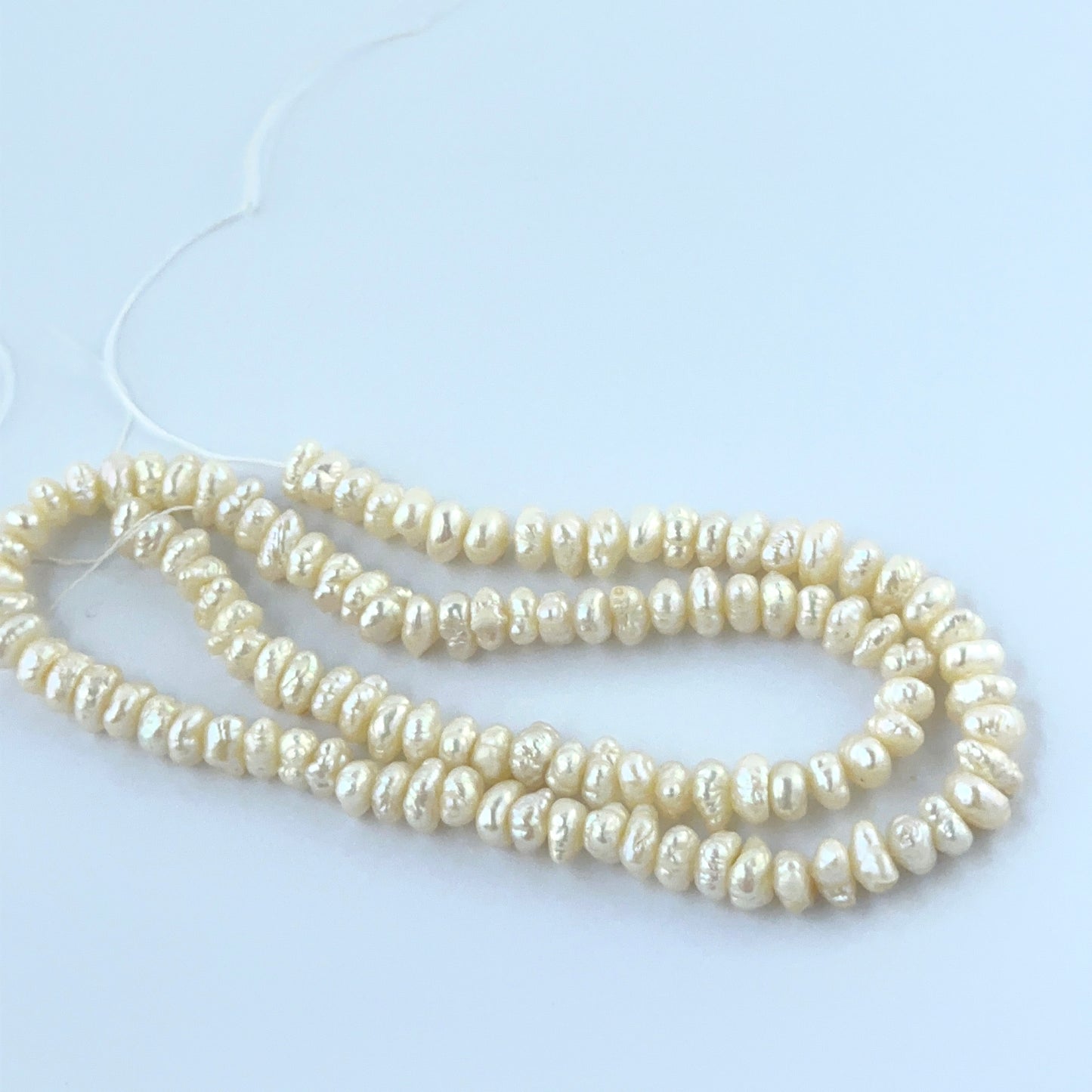 Natural Freshwater Pearl baroque beads showing soft lustre and organic shapes.