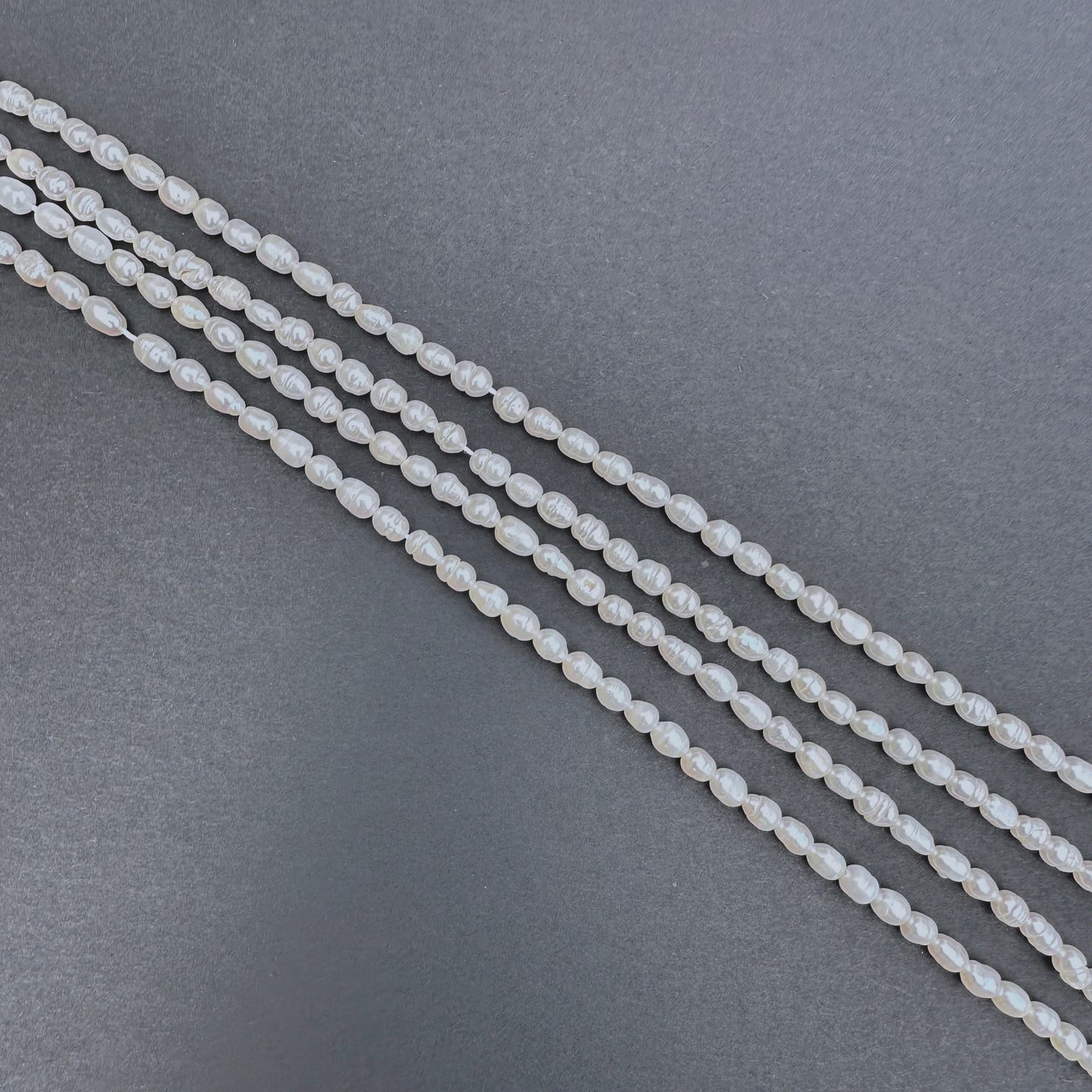Handmade jewellery components featuring 3.9-4.3mm Freshwater Pearl stone beads.