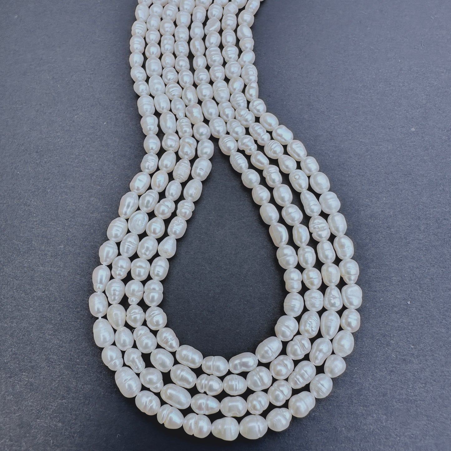 Freshwater Pearl stone beads with smooth rice shape and radiant lustre.