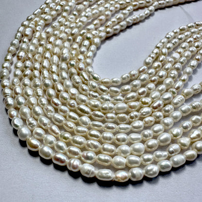 Glossy 3mm Freshwater Pearls with rice shape and 0.4mm drill holes, perfect for delicate threading.