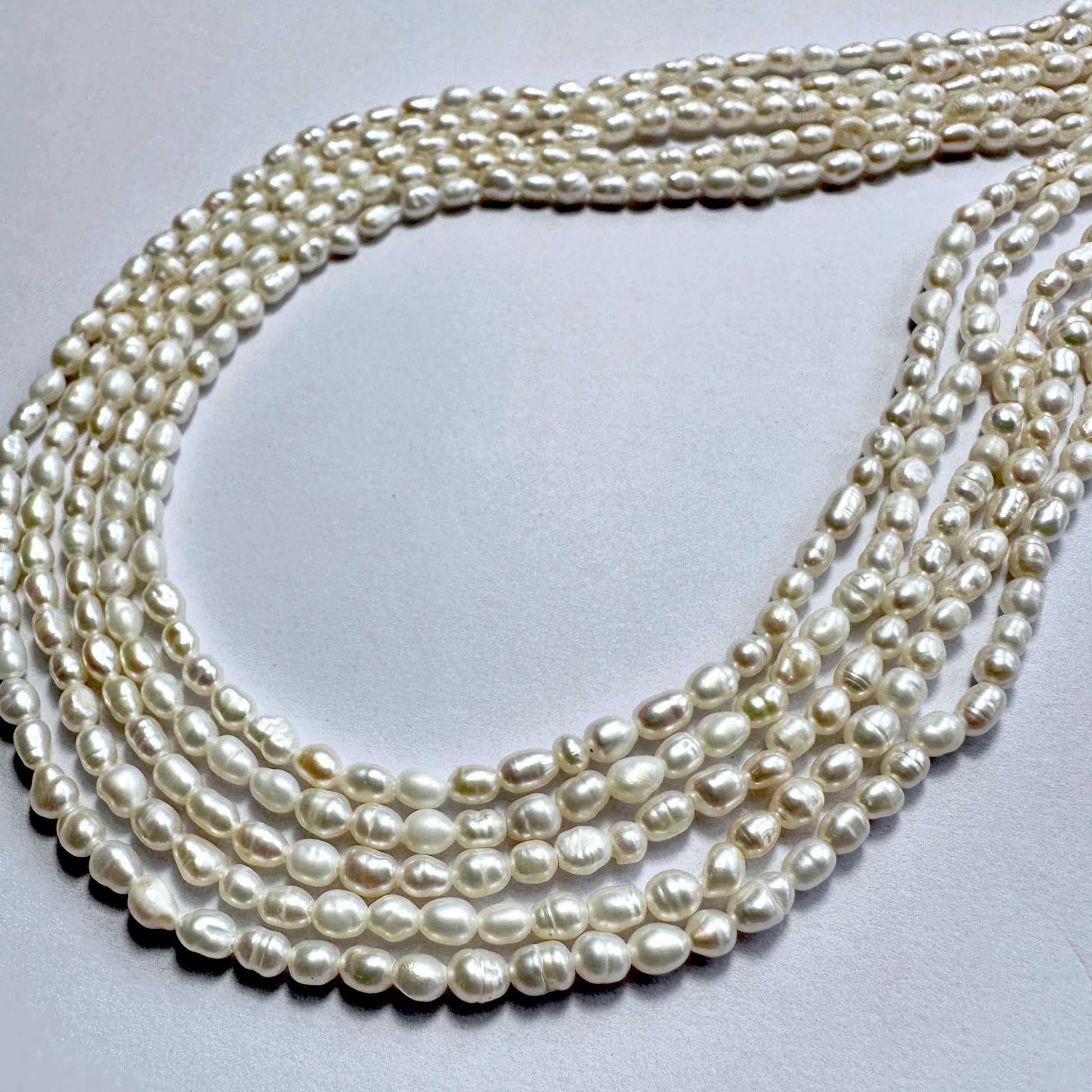 Freshwater rice pearls in 3mm size, arranged on a 35cm strand with soft ivory colour and smooth surface.