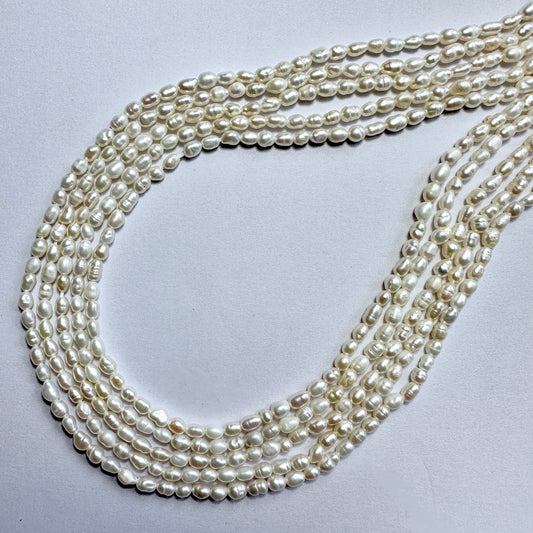 Freshwater rice pearls in 3mm size, arranged on a 35cm strand with soft ivory colour and smooth surface.
