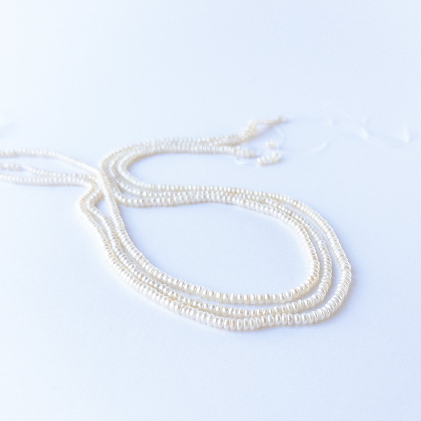 Close‑up of Freshwater Pearl rondelle beads showing natural lustre, smooth shaping and high‑quality craftsmanship.