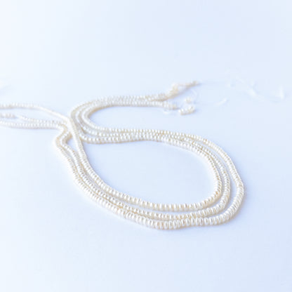 Close‑up of Freshwater Pearl rondelle beads showing natural lustre, smooth shaping and high‑quality craftsmanship.