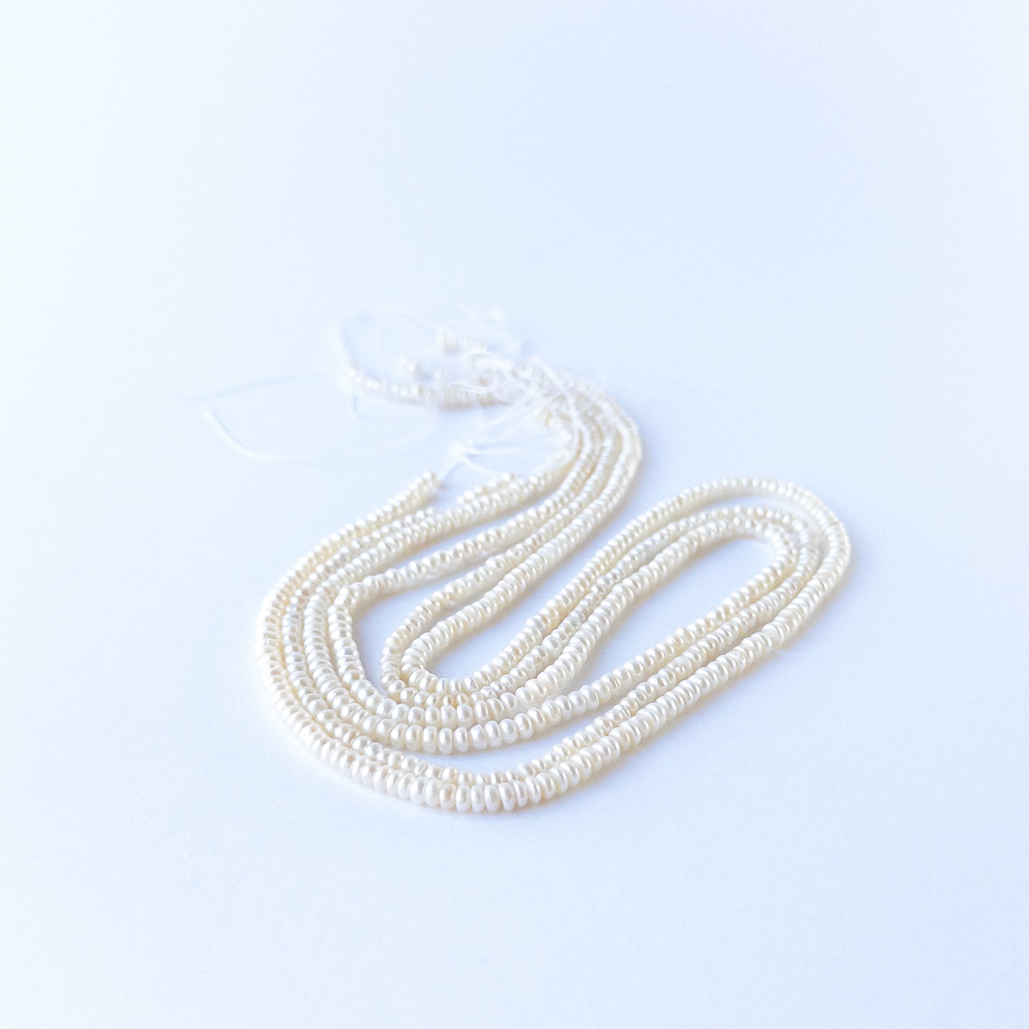 Freshwater Pearl rondelle beads with elegant shine, perfect for DIY jewellery makers using authentic gemstone beads.