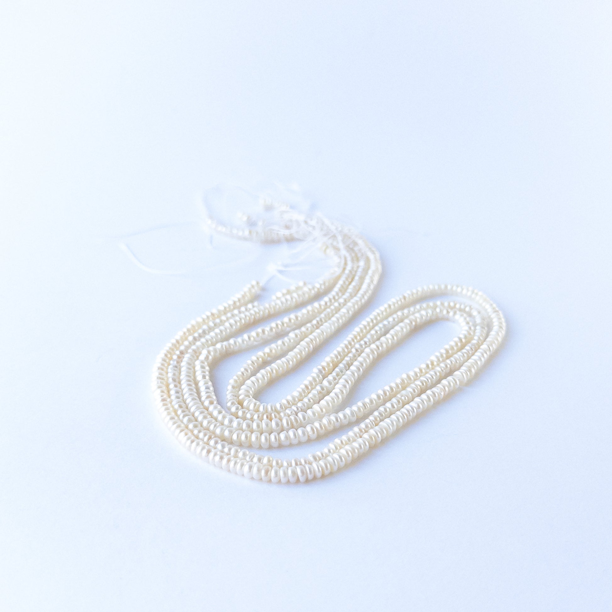 Freshwater Pearl rondelle beads with elegant shine, perfect for DIY jewellery makers using authentic gemstone beads.