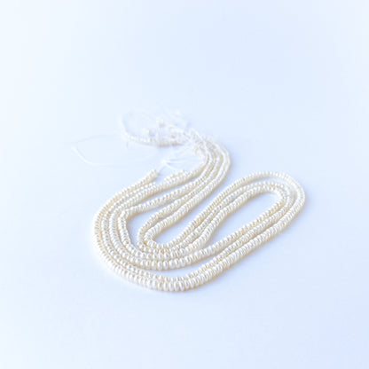 Freshwater Pearl rondelle beads with elegant shine, perfect for DIY jewellery makers using authentic gemstone beads.