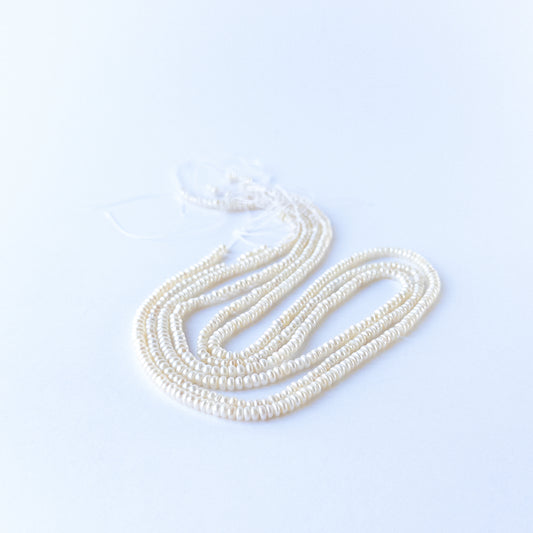 Freshwater Pearl rondelle beads with elegant shine, perfect for DIY jewellery makers using authentic gemstone beads.