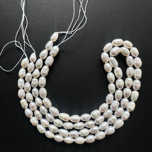 Natural gemstone beads featuring Freshwater Pearls with a creamy white sheen and smooth surface.