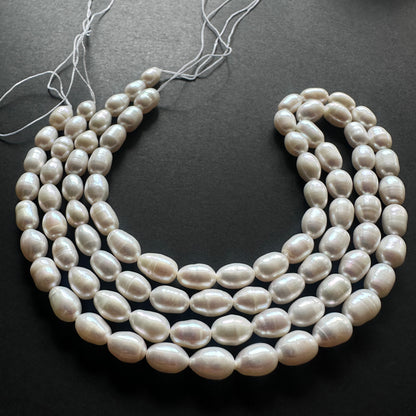 Close-up of Freshwater Pearls showcasing their round shape and luminous glow.