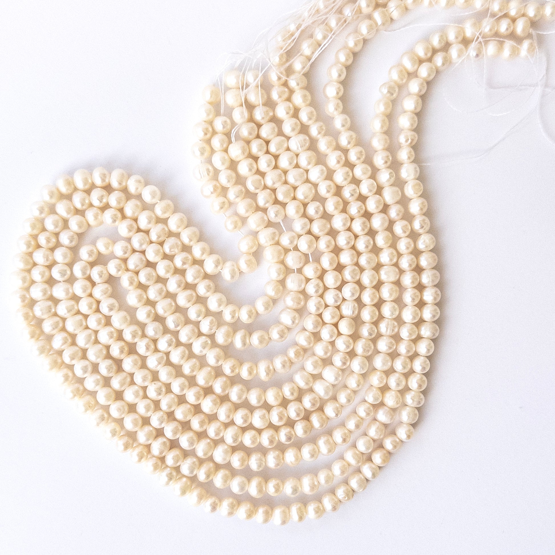 High‑quality Freshwater Pearl rondelle beads showcasing refined shaping and a luminous pearl glow.