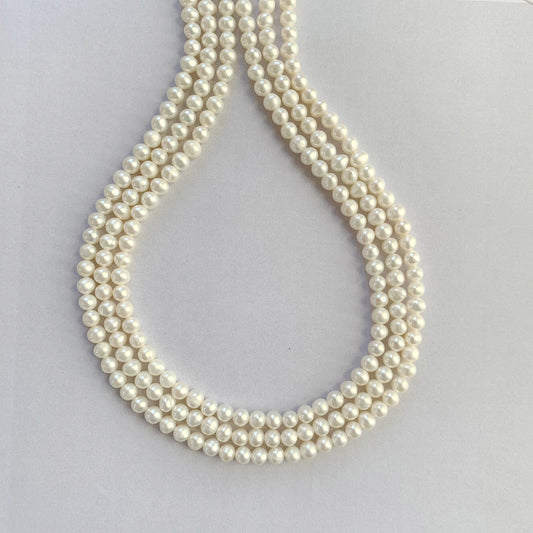 Freshwater pearls in smooth round shape, strung in a neat 40cm line with white lustre.