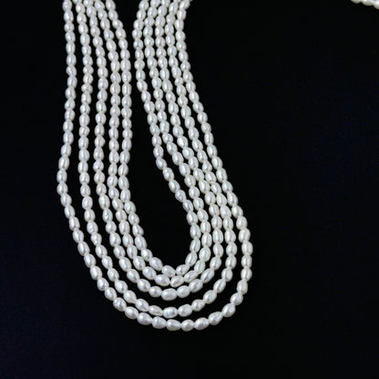 Smooth freshwater rice pearls showing soft lustre and consistent handmade jewellery component quality.