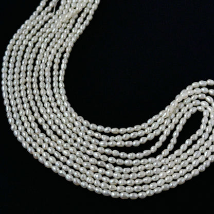 Pearl beads for DIY jewellery featuring polished rice pearls with even sizing and elegant shine.