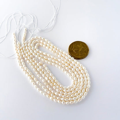 Close view of freshwater rice pearls showing surface texture and premium quality.
