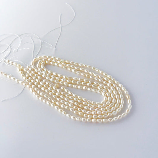 Freshwater rice pearls showing soft lustre and gently elongated natural shaping.
