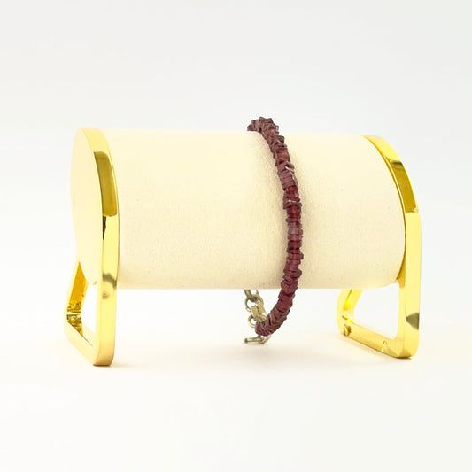 Square heishi garnet bead bracelet crafted in a single adjustable strand.