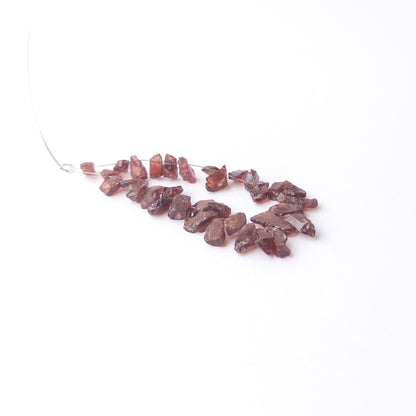 High‑quality Garnet drilled rough beads with rich red sparkle ideal for handmade jewellery components.