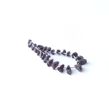 Garnet drilled rough beads in deep red tones, genuine gemstone beads ideal for handmade jewellery components.