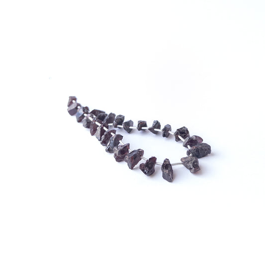 Garnet drilled rough beads in deep red tones, genuine gemstone beads ideal for handmade jewellery components.