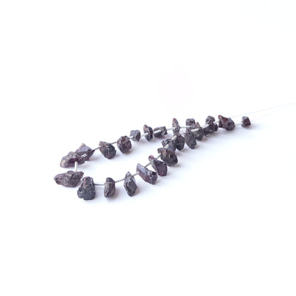 Genuine Garnet gemstone beads showcasing earthy colour and organic form, perfect for artisan jewellery design projects.
