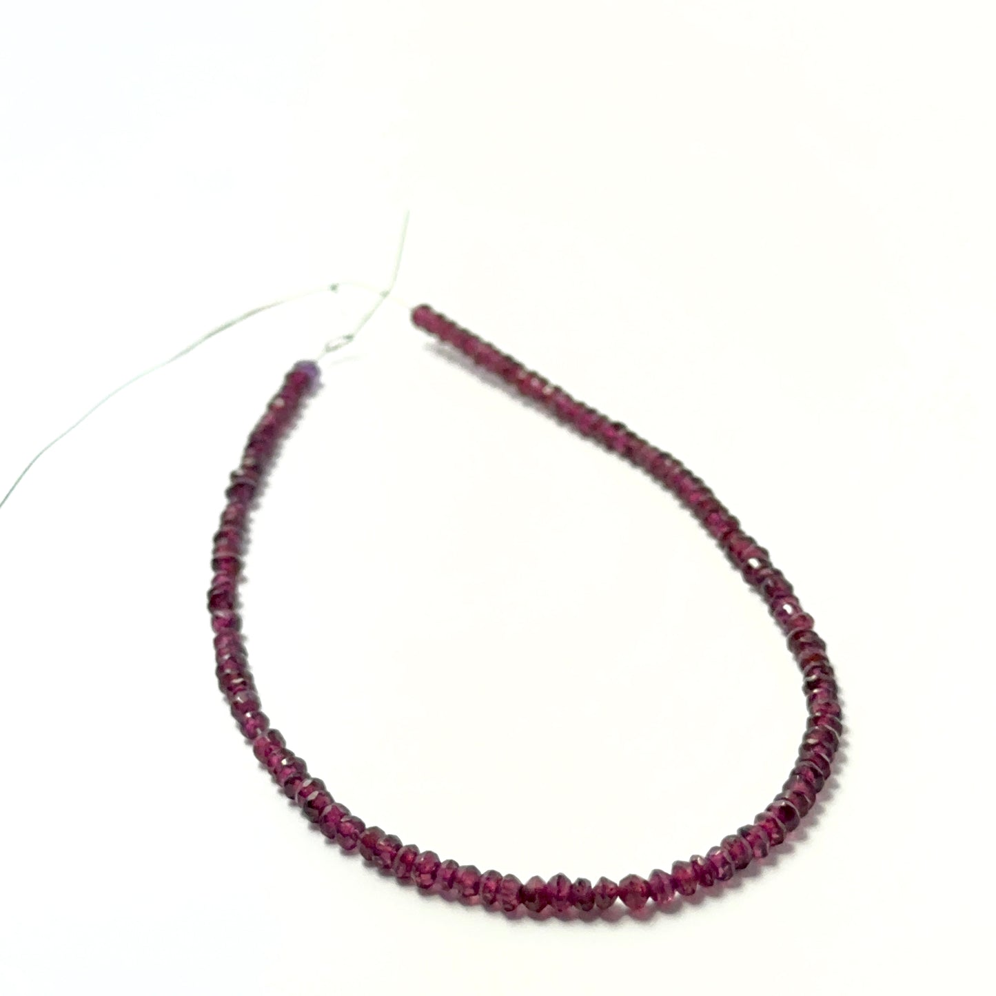 Deep red garnet rondelle beads with crisp faceting and smooth polish, perfect for premium handmade jewellery designs.