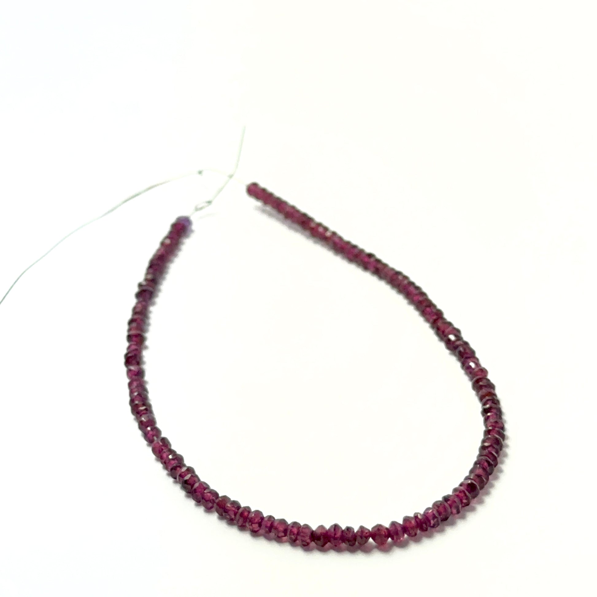 Deep red garnet rondelle beads with crisp faceting and smooth polish, perfect for premium handmade jewellery designs.