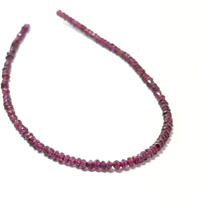 Garnet faceted rondelle beads in deep red tones, 2.7–2.9mm, arranged on a 20cm strand for handmade jewellery components.