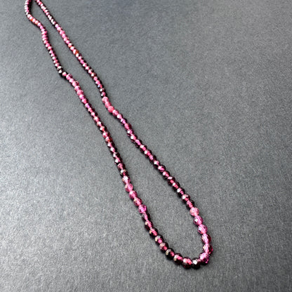 Handmade jewellery components showcasing garnet stone beads with sparkling facets and natural gemstone quality.