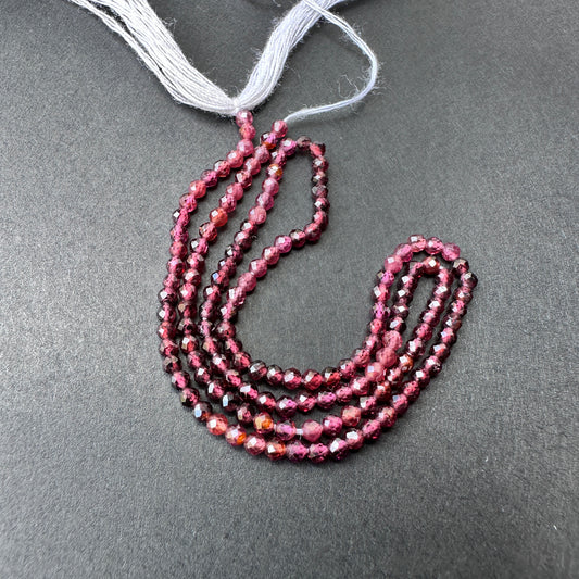 Natural gemstone beads in garnet with precision faceting and consistent arrangement on a 33cm strand.