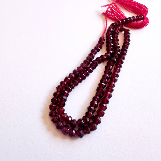 Natural gemstone beads with deep red tones and faceted sparkle, ideal for DIY jewellery projects.
