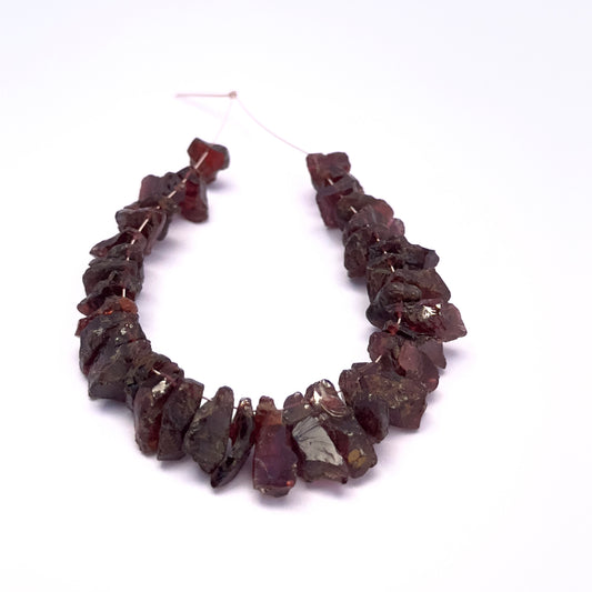 Natural Garnet stone beads with irregular shapes and organic character.
