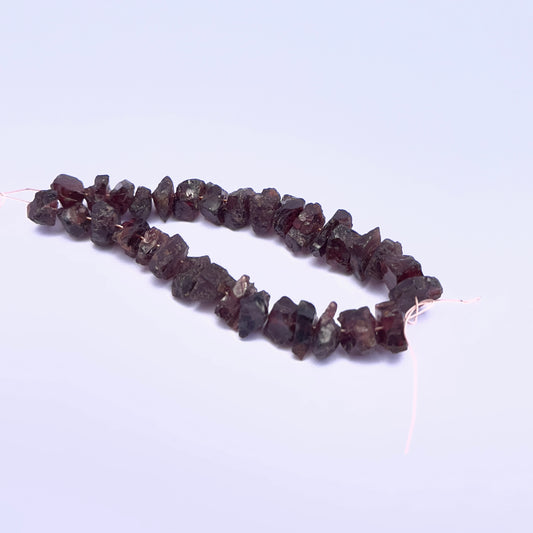 Natural Garnet stone beads with irregular shapes and organic character.