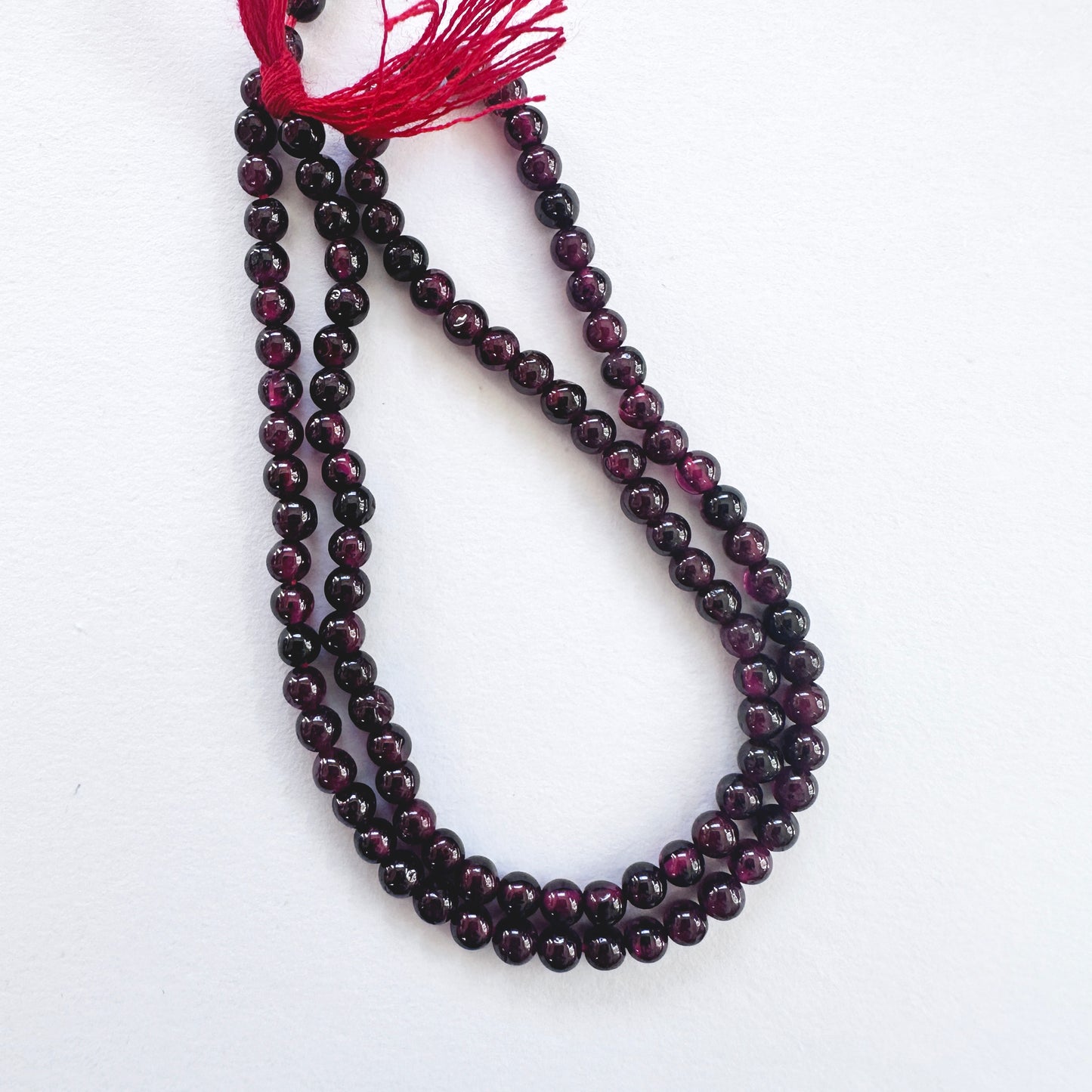 Handmade jewellery components featuring 3.5mm Garnet stone beads.