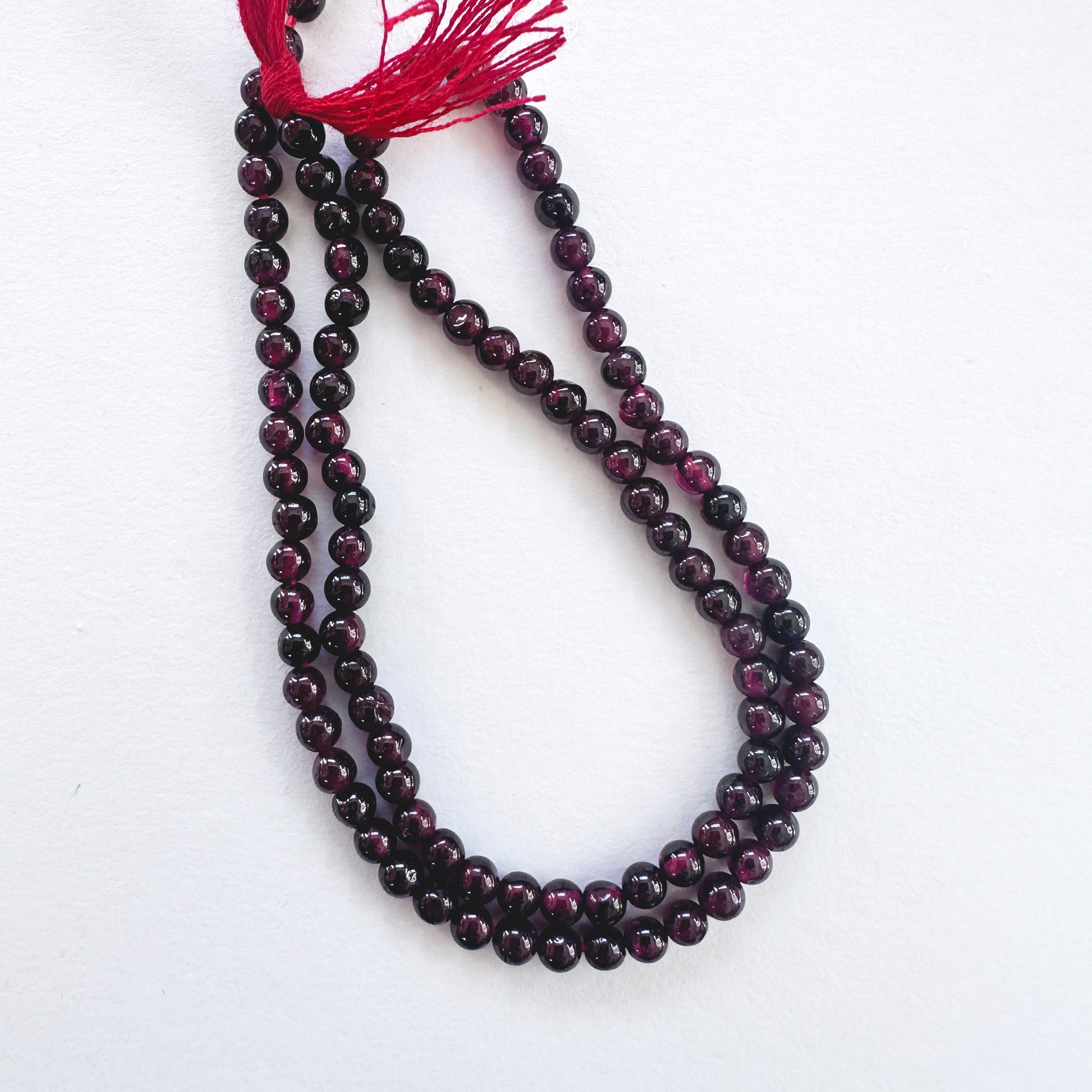 Handmade jewellery components featuring 3.5mm Garnet stone beads.