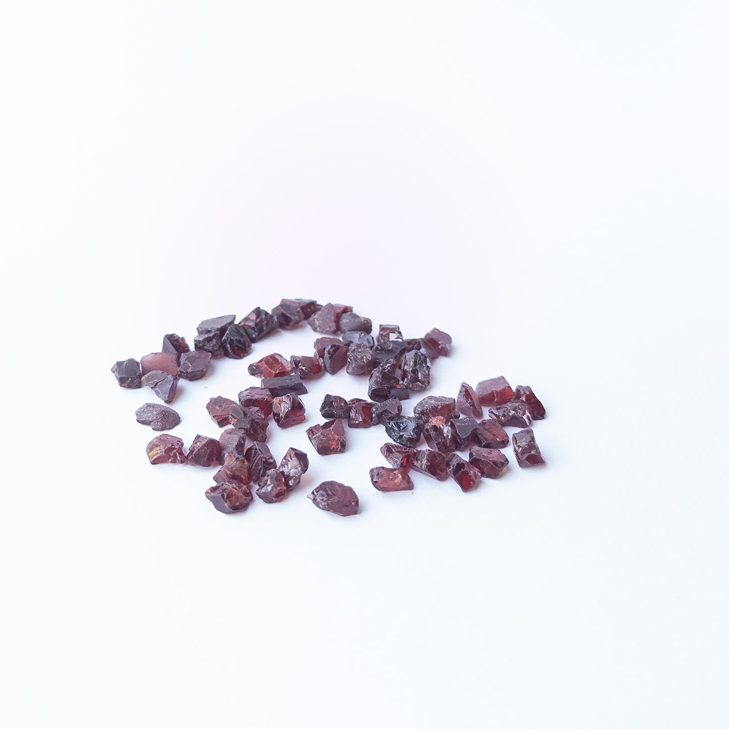 Vibrant Garnet rough stones with earthy red colour and raw texture for jewellery designers.