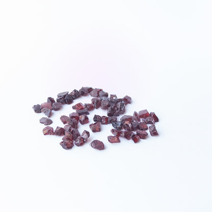 Vibrant Garnet rough stones with earthy red colour and raw texture for jewellery designers.