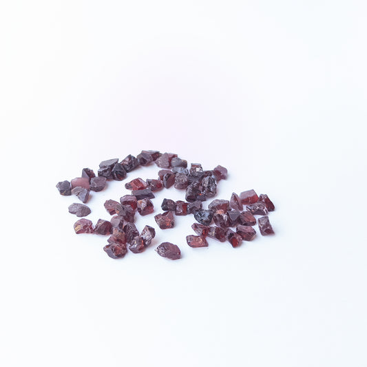 Vibrant Garnet rough stones with earthy red colour and raw texture for jewellery designers.