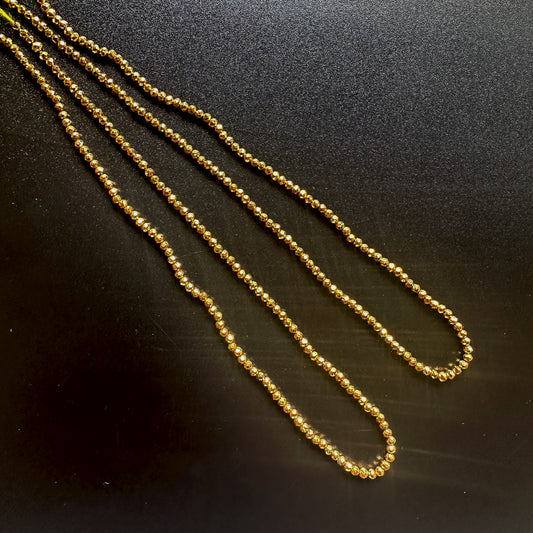 Gold pyrite rondelle beads with faceted cut and metallic gold shine on a 32cm strand.