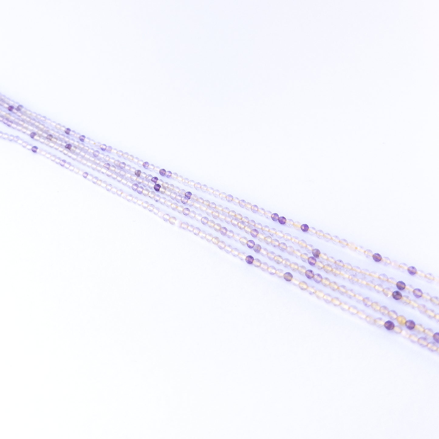Premium golden rutile gemstone beads for DIY jewellery, displaying faceted rondelle cuts and striking golden inclusions.