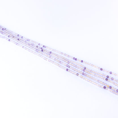 Premium golden rutile gemstone beads for DIY jewellery, displaying faceted rondelle cuts and striking golden inclusions.