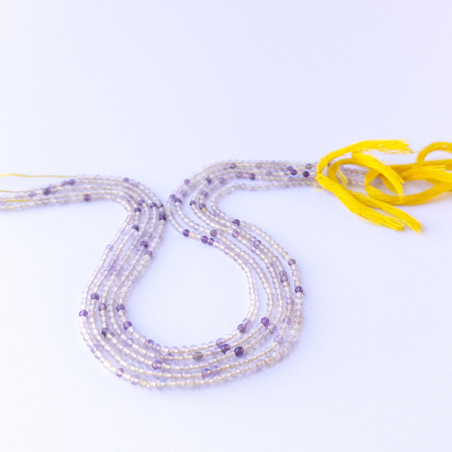 Genuine stone beads with golden needle inclusions, featuring faceted rondelles for DIY jewellery making.