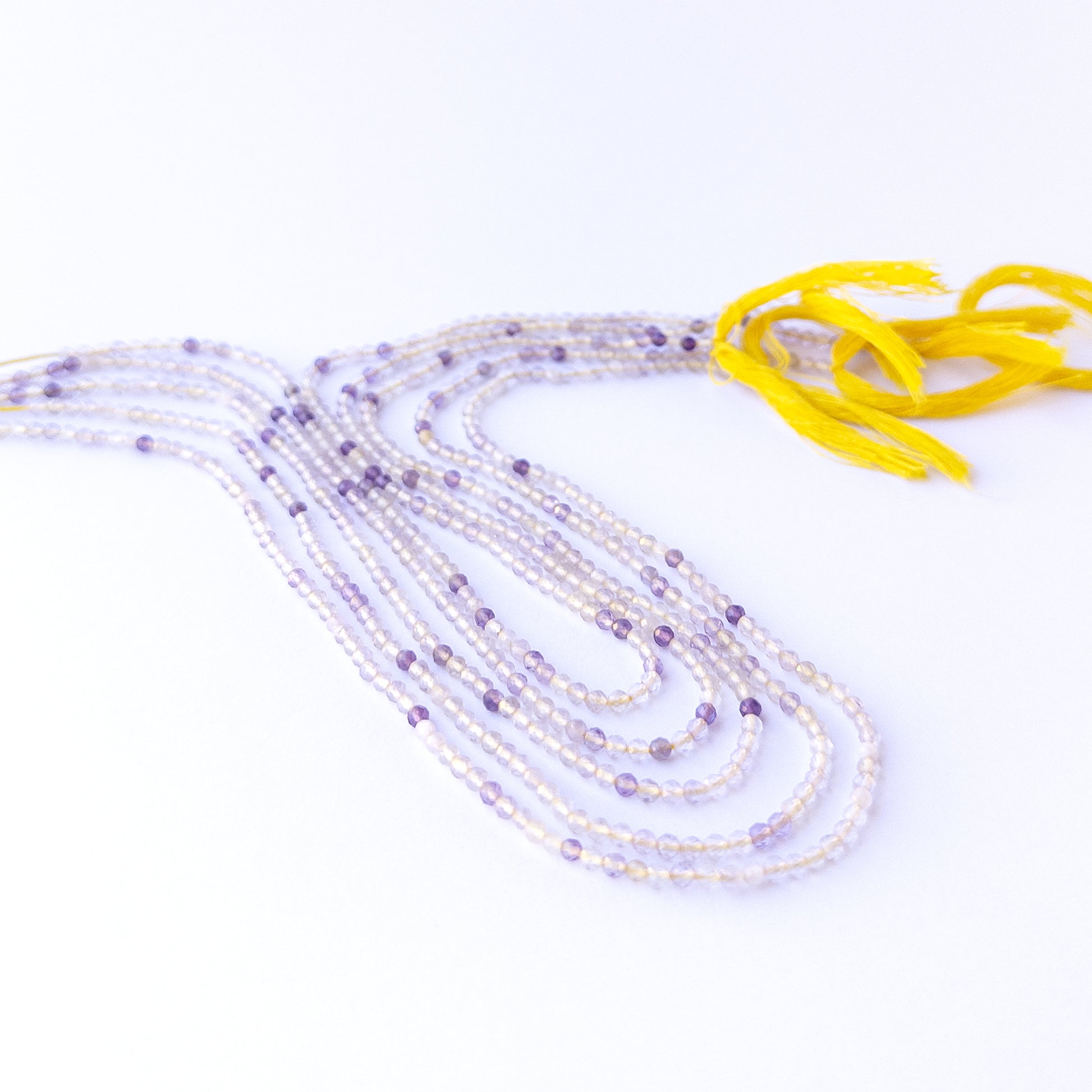 High‑quality golden rutile rondelle gemstone beads with bright shine and natural rutile patterns on a long strand.