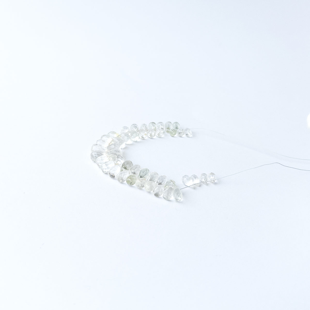 Handmade jewellery components crafted from Green Amethyst briolette beads with luminous clarity and sparkle.